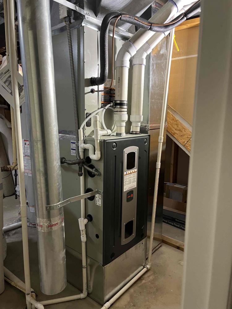 Modern furnace in basement utility room